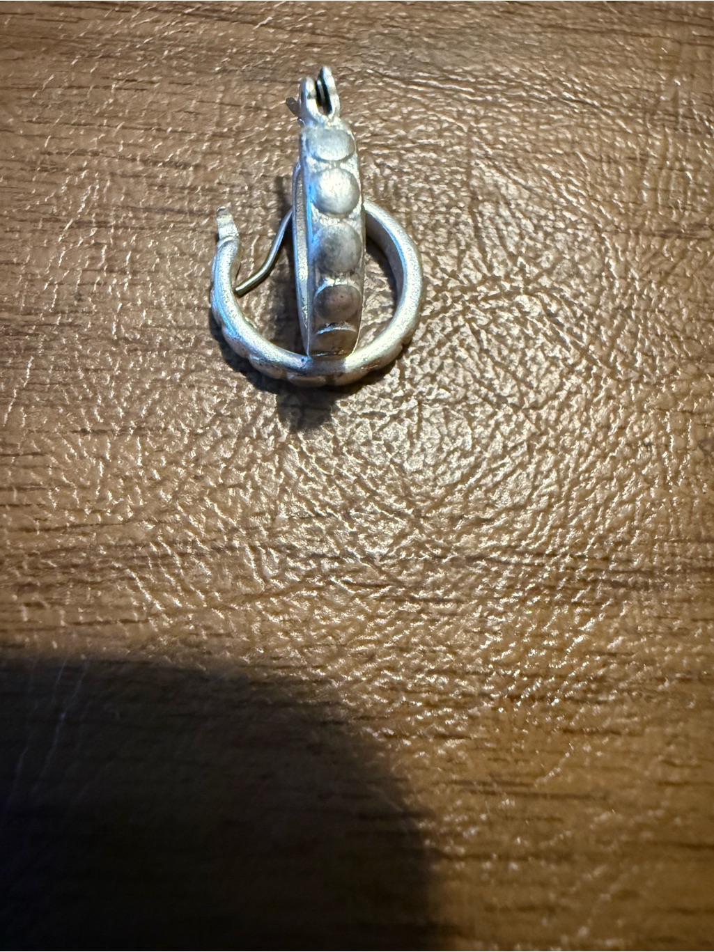Sterling Silver 925 Hoop Earring Featuring An Etched Or Textured Pattern.